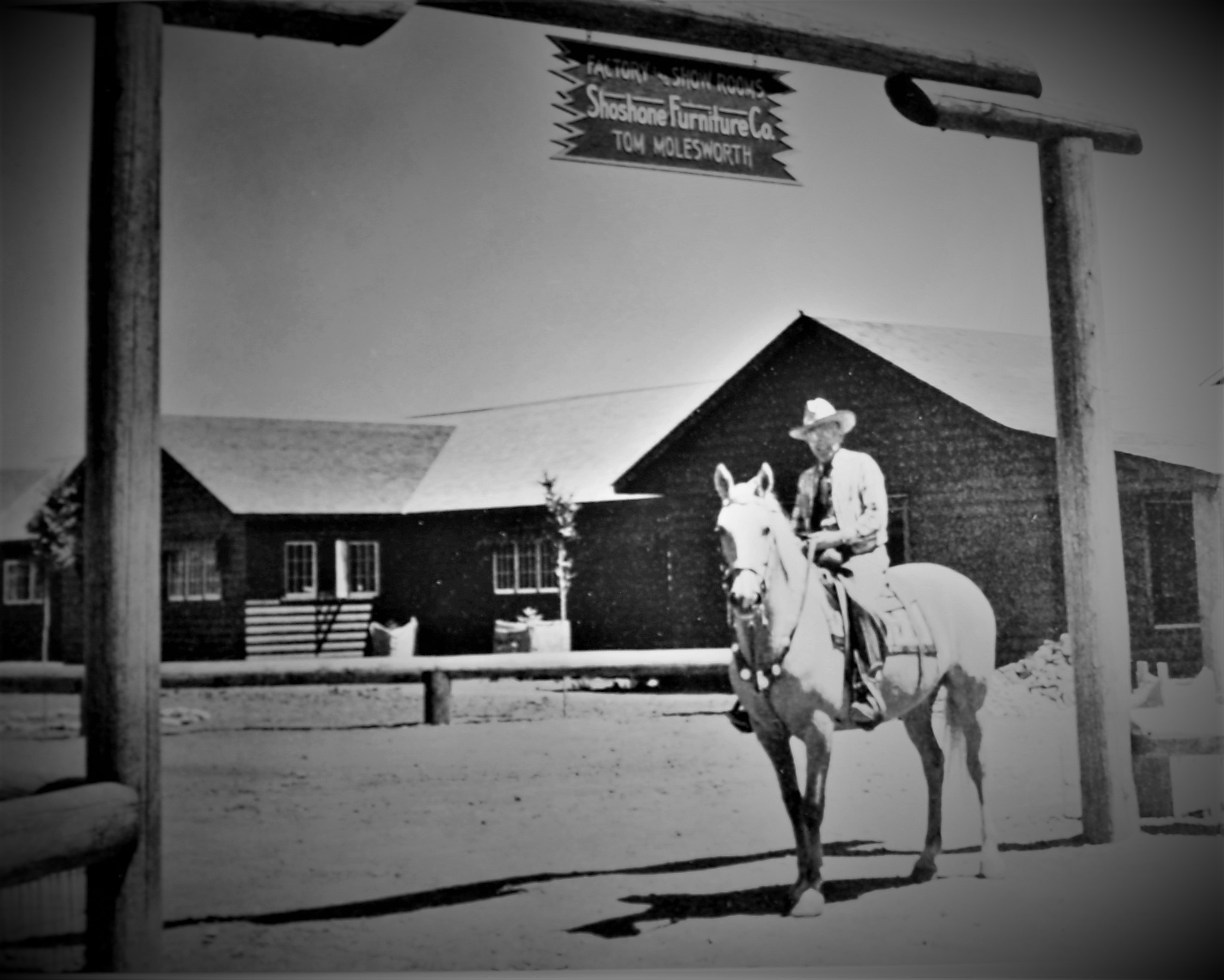 Tom  atop Silver at entrance to Shoshone Furniture's factory and show rooms